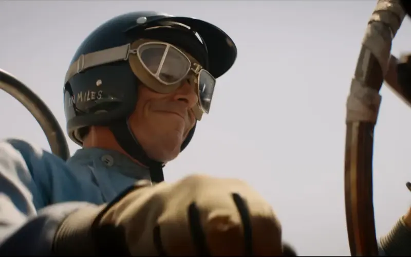 Scene from Ford v Ferrari with Christian Bale as Ken Miles in a race car – similar to F1: The Movie